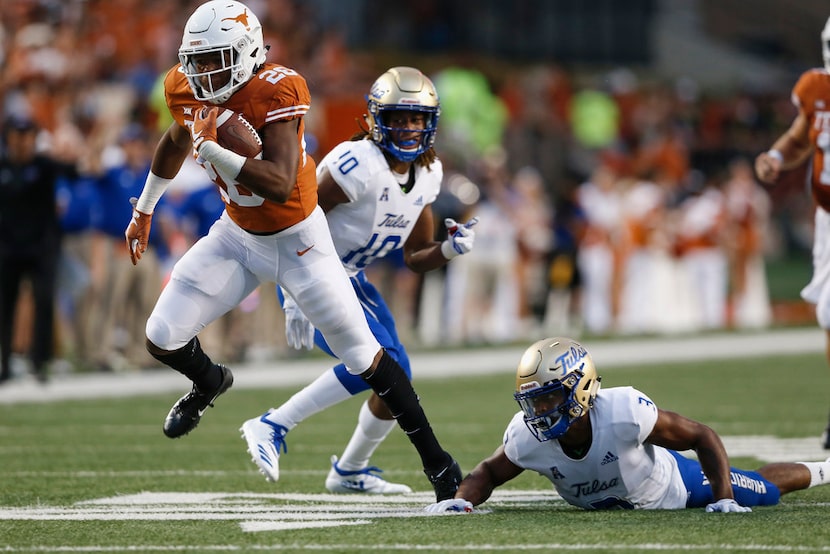 AUSTIN, TX - SEPTEMBER 08:  Keaontay Ingram #26 of the Texas Longhorns breaks free from...