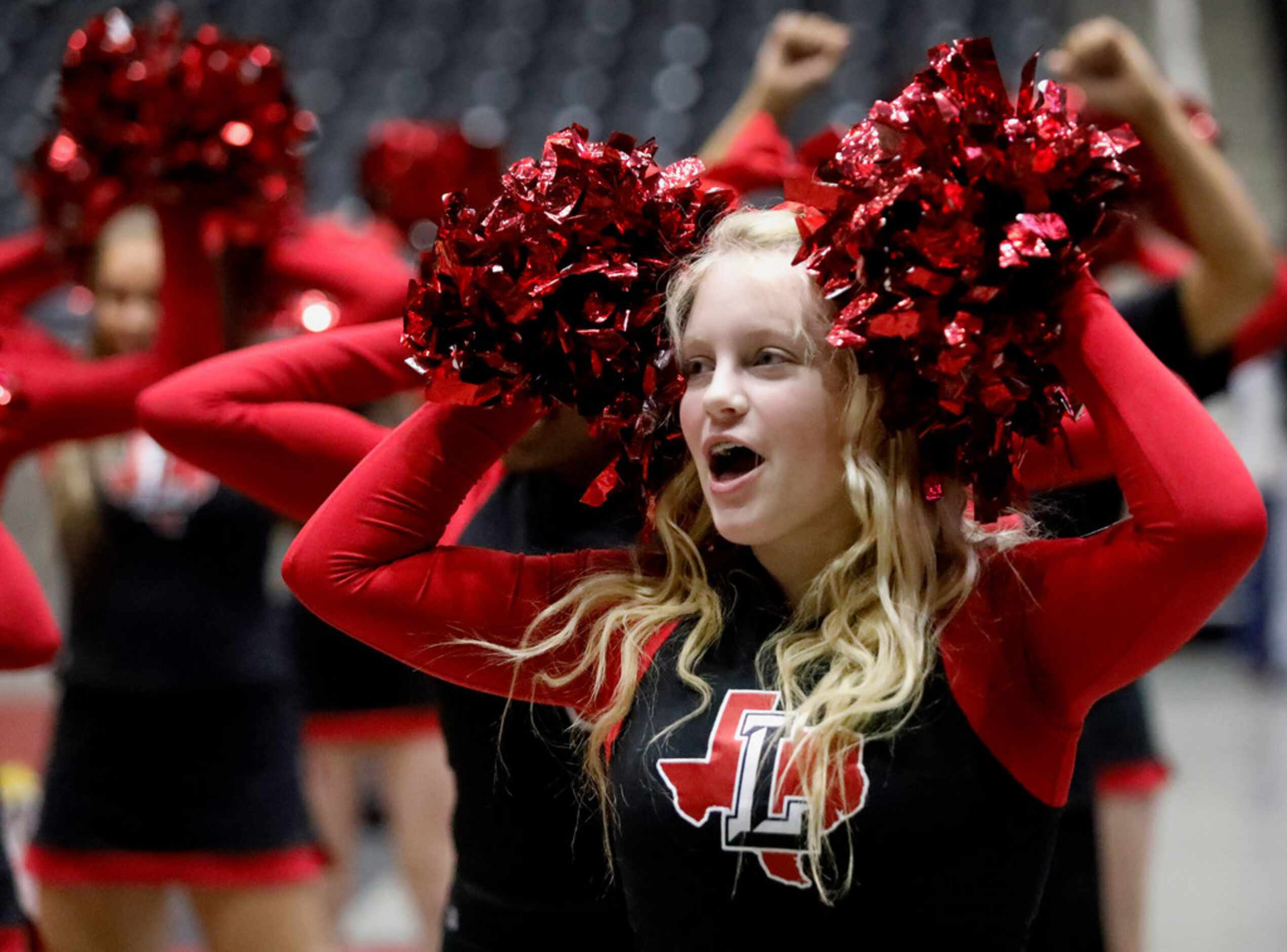 Frisco Liberty High School cheerleader Sydney Heal, 16, of Frisco, cheers during the second...