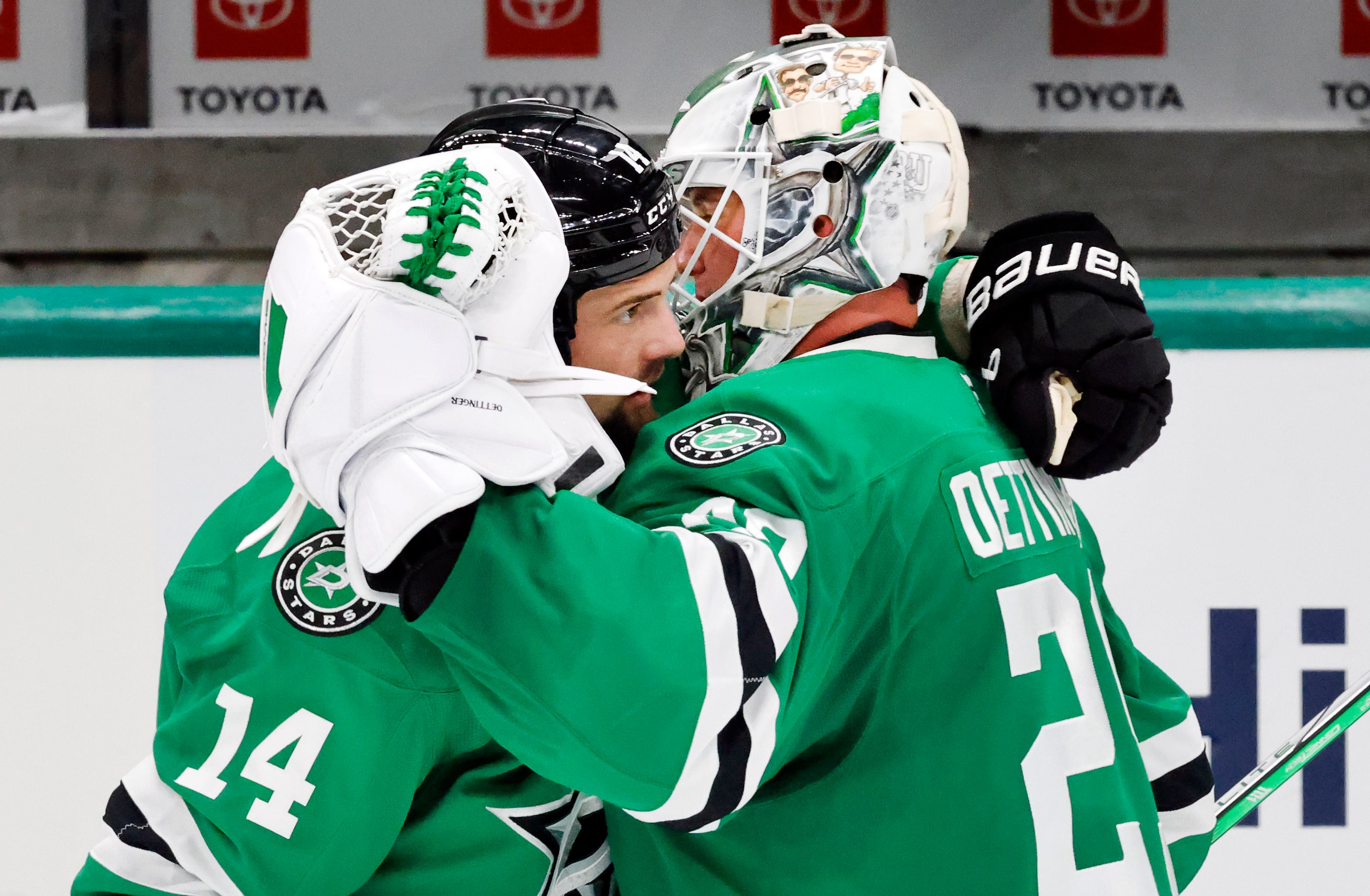 Dallas Stars left wing Jamie Benn (14) congratulates goaltender Jake Oettinger (29) after he...