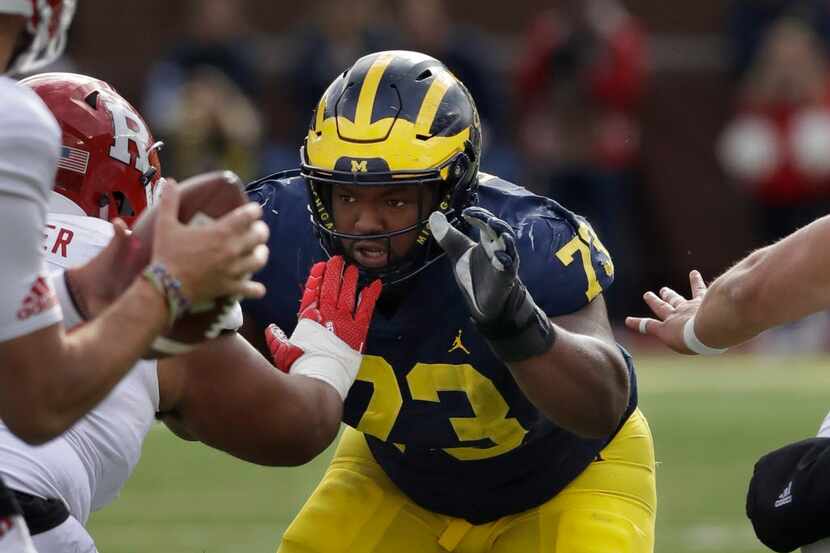 FILE - In this Oct. 28, 2017, file photo, Michigan defensive lineman Maurice Hurst (73) goes...
