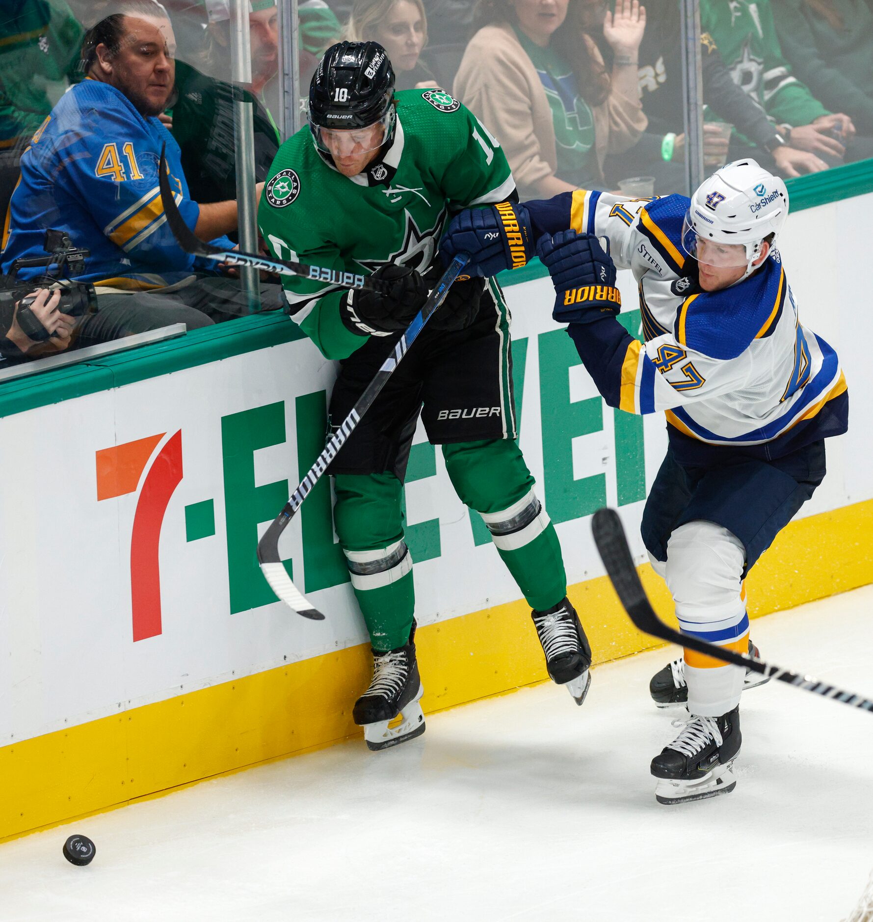 St. Louis Blues defenseman Torey Krug (47) hits Dallas Stars center Ty Dellandrea (10) into...