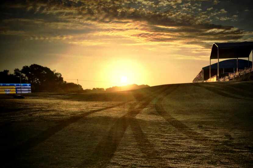 The sun rises over Trinity Forest Golf Club on May 17, before the start of the first round...