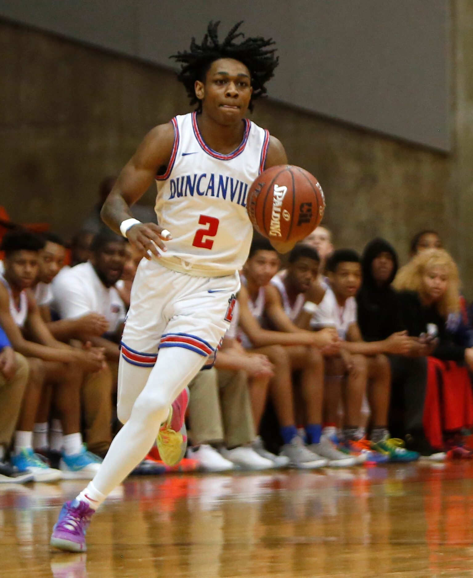 Duncanville guard Ja'Bryant Hill (2) sets up an offensive play as he dribbles past the team...