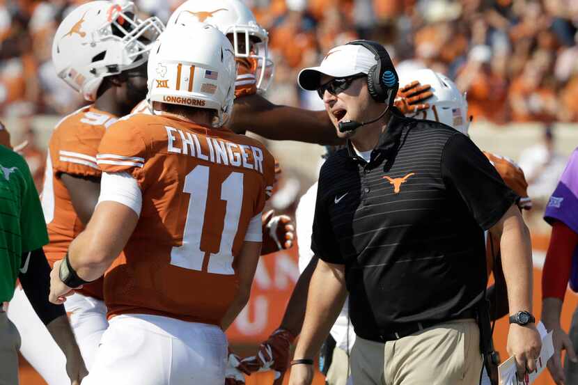 FILE - In this Saturday, Sept. 9, 2017, file photo, Texas head coach Tom Herman, right,...