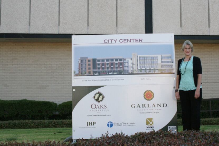 Garland Director of Organizational Development Rebecca King stands in front of a sign that...