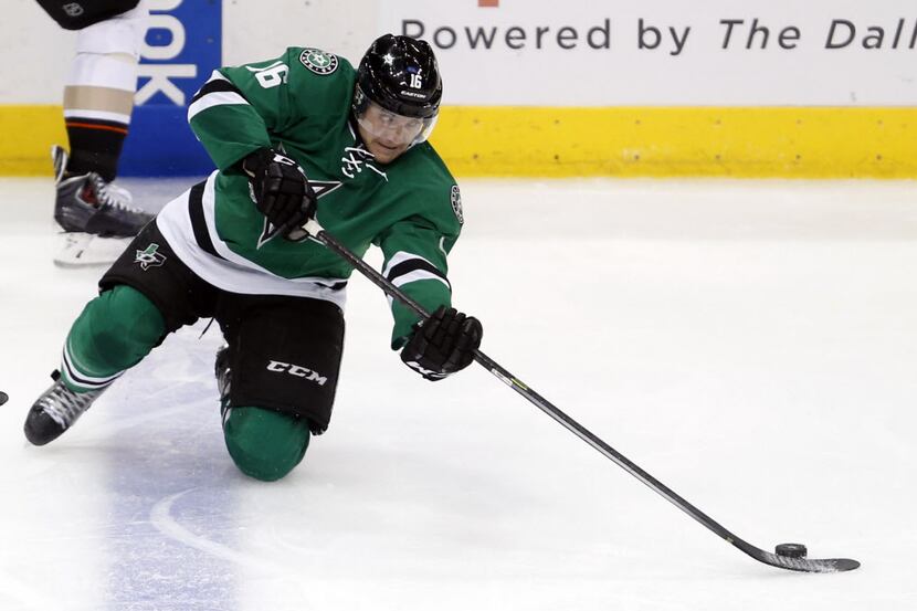 Dallas Stars left wing Ryan Garbutt (16) reaches for the puck during the third period of...