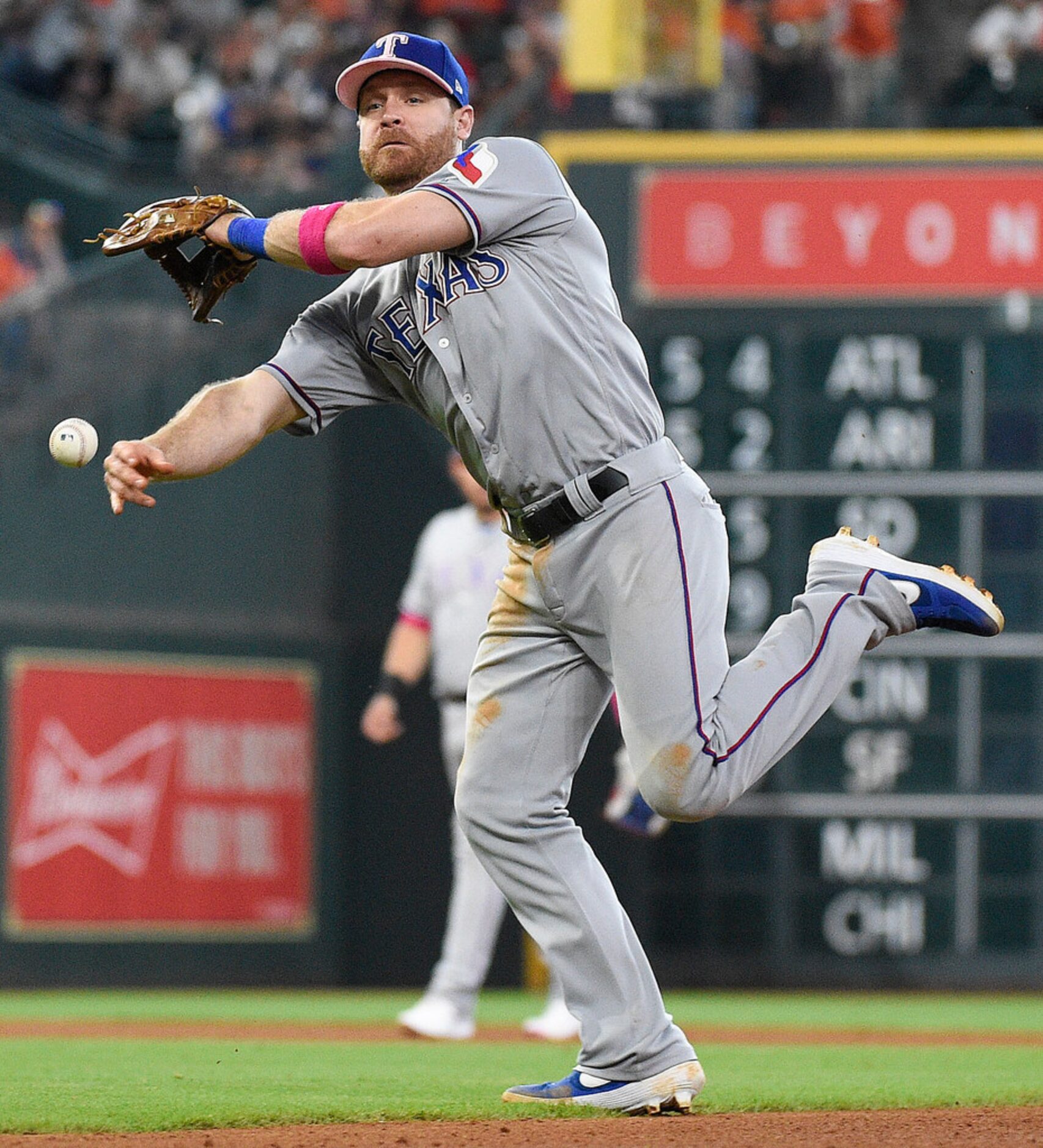 Texas Rangers second baseman Logan Forsythe attempts to throw out Houston Astros' Tony Kemp...