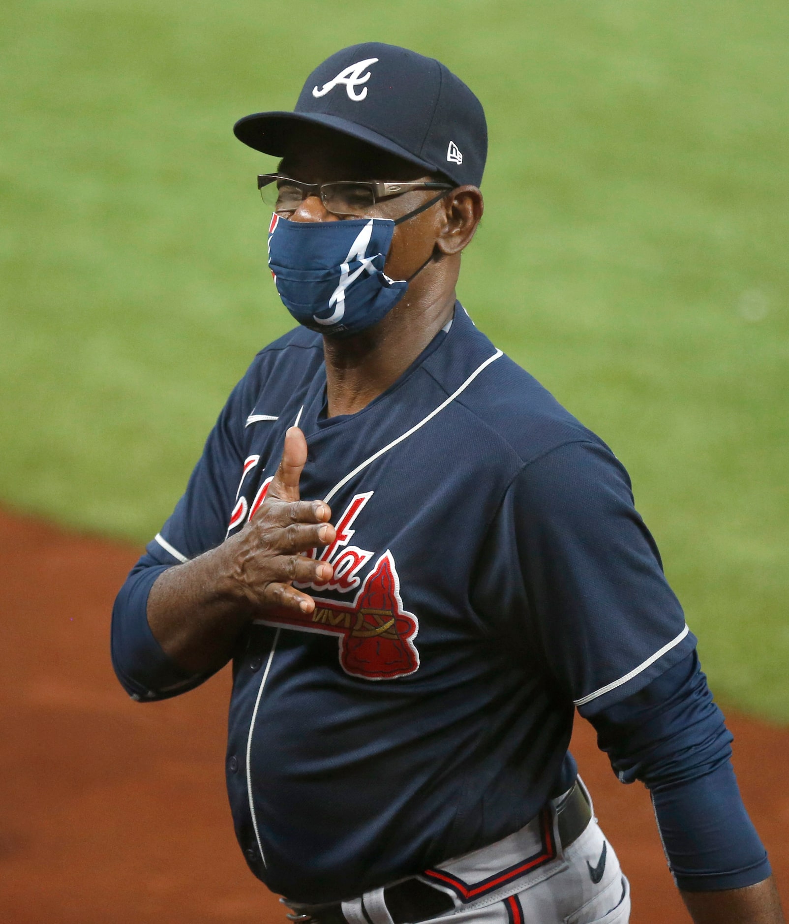 Atlanta Braves third base coach Ron Washington (37) acknowledges fans before a game against...