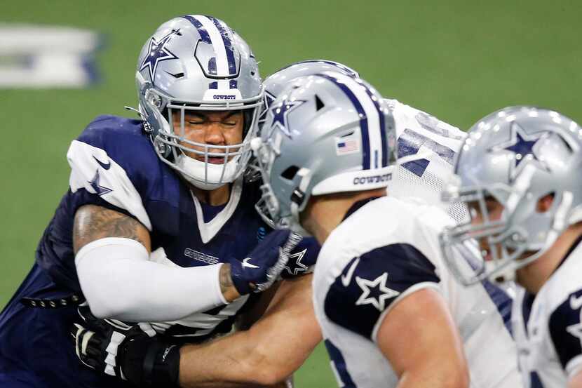 Cowboys defensive tackle Trysten Hill (72) works to get by offensive guard Cody Wichmann...