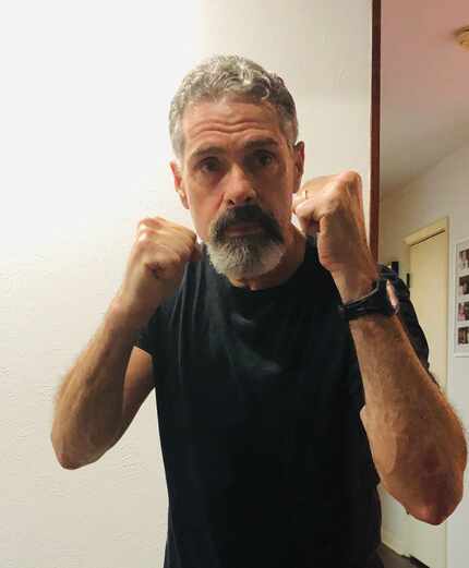 Harold Recinos performs a shadow-boxing move. He works out at the Oak Lawn Boxing gym.