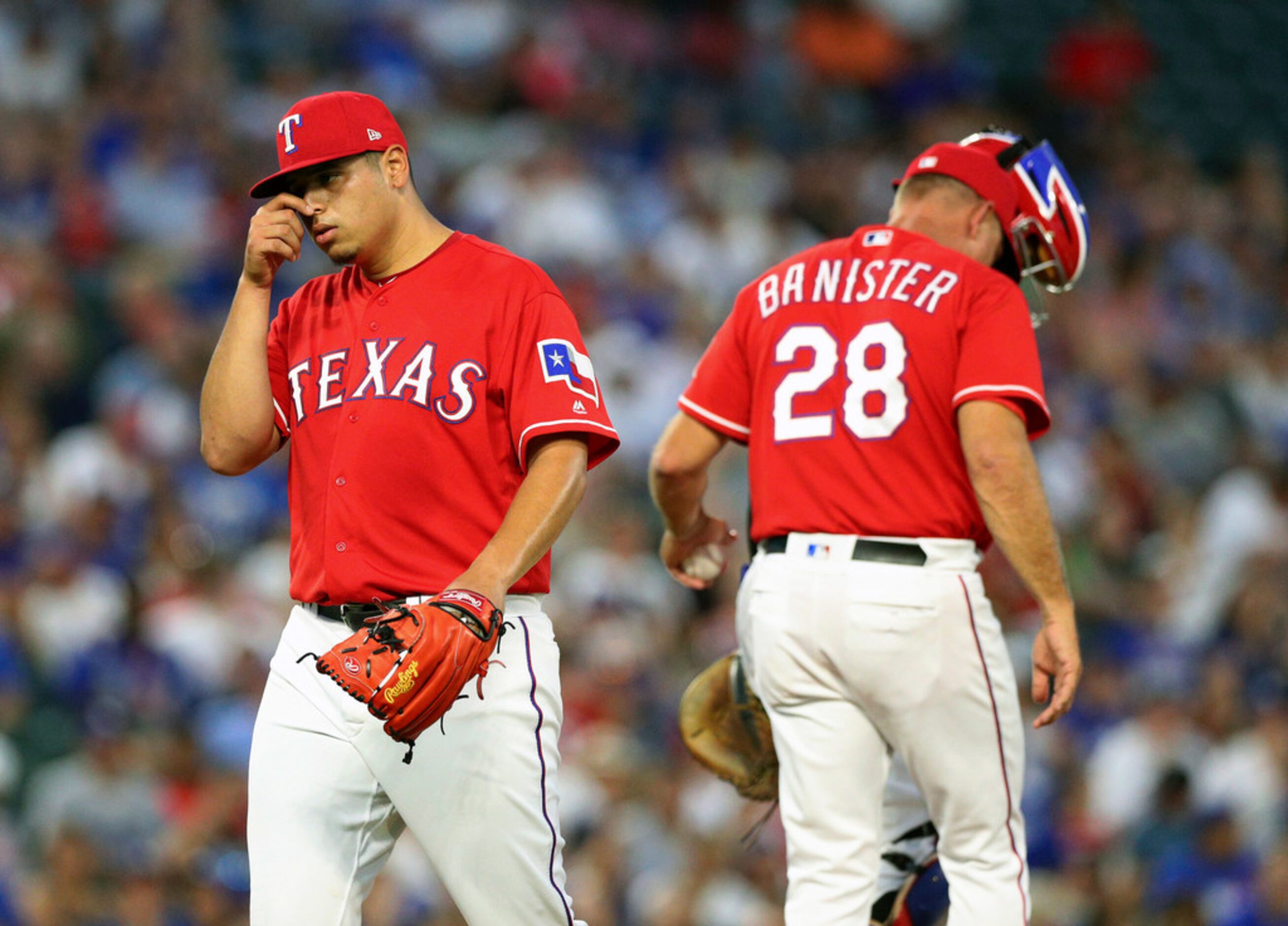 Texas Rangers starting pitcher Ariel Jurado (57) is relieved in the third inning of a...