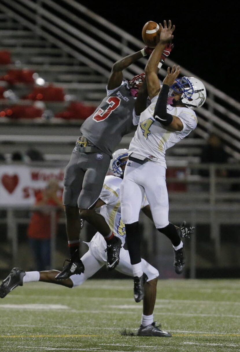 TXHSFB Conrad senior defensive back Jonus Williams (4, right) breaks up a pass intended for...