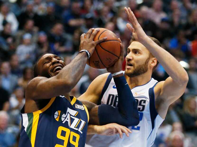 Utah Jazz forward Jae Crowder (99) drives to the basket as he is defended by Dallas...