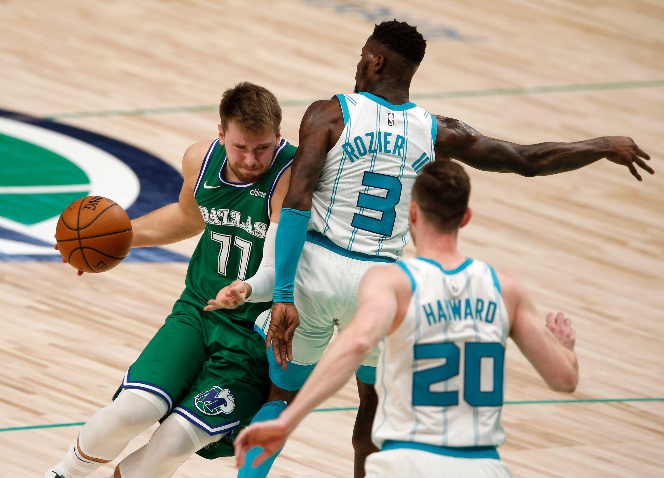 Dallas Mavericks guard Luka Doncic (77) attempts to get around Charlotte Hornets guard Terry...