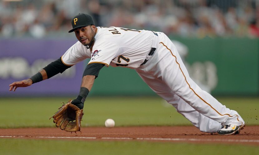 ORG XMIT: PAKS108 Pittsburgh Pirates third baseman Pedro Alvarez dives for a ground ball by...