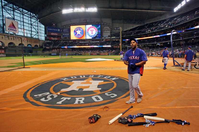 Texas shortstop Elvis Andrus talks with fans during batting practice before the Texas...
