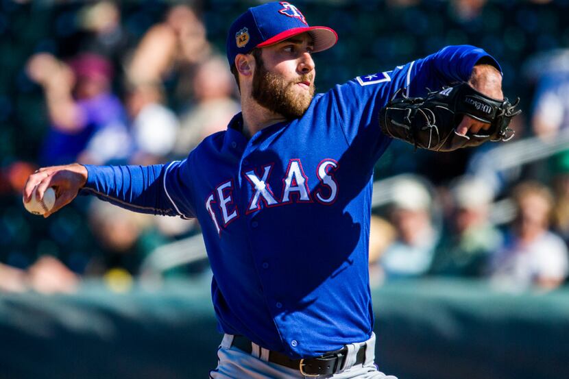 Texas Rangers relief pitcher Anthony Bass (60) pitches during the sixth inning of a spring...