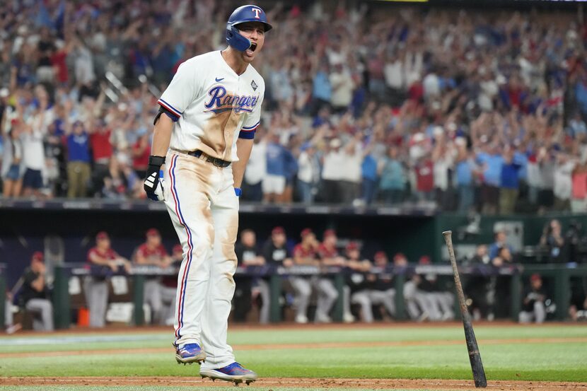 Texas Rangers' Corey Seager celebrated after hitting a two-run home run to tie the game...