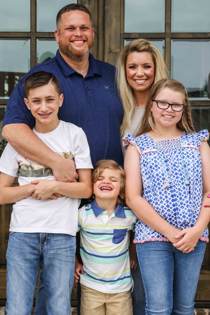 Tyler Tines Pride's family from left, Braydan, Jaxon, his wife Charity and Maddison, pose...