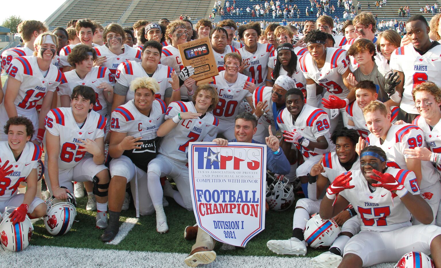 Parish Episcopal head coach Daniel Novakov poses with members of his team following their...