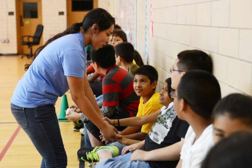 
Garza talks to a child at Boys & Girls Clubs of Greater Dallas. She won the organization's...