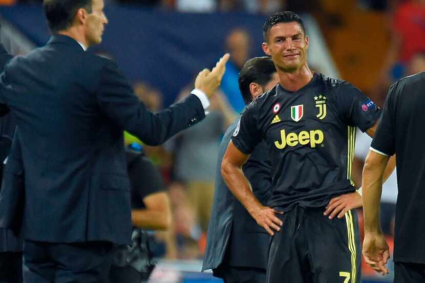 TOPSHOT - Juventus' Portuguese forward Cristiano Ronaldo reacts after receiving a red card...