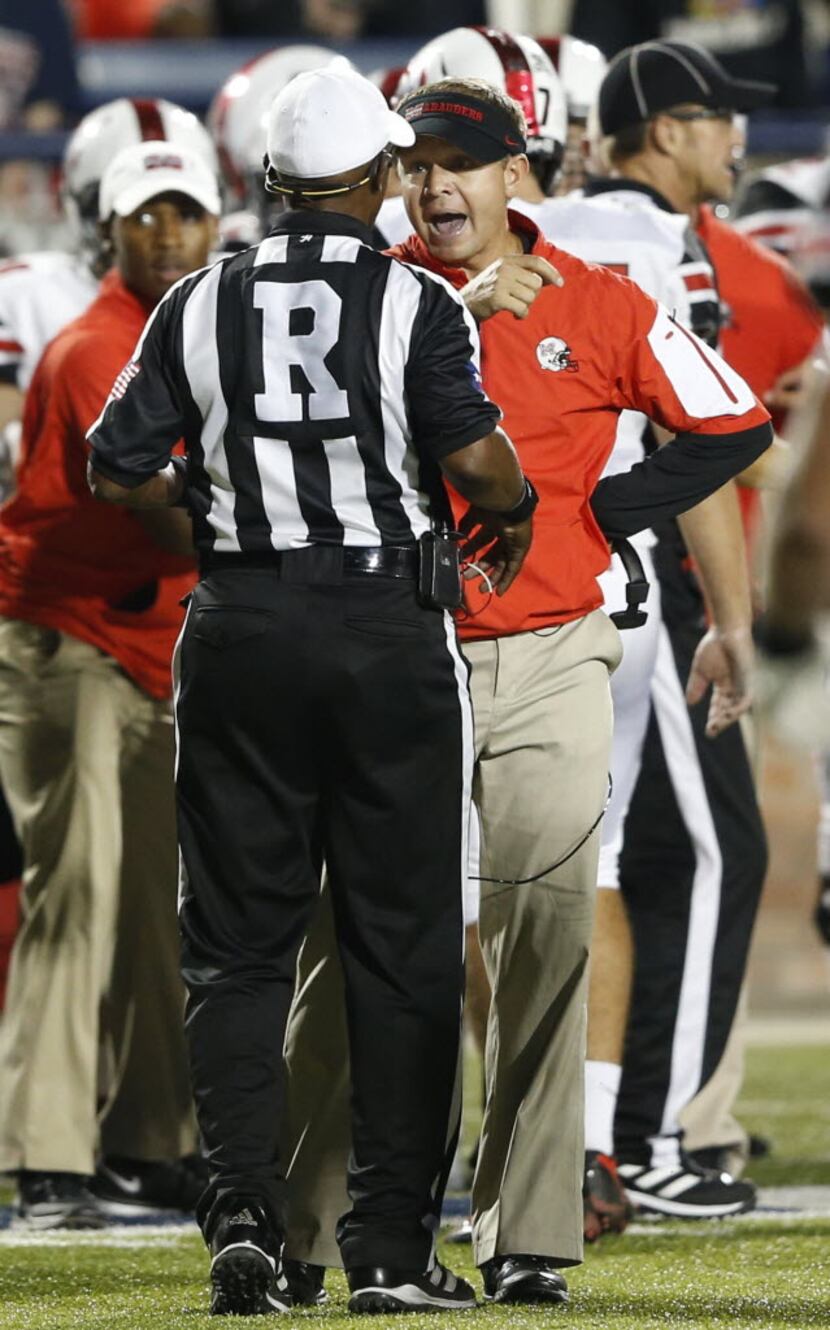 Flower Mound Marcus' head coach Gerry Stanford argues with a referee about a call involving...