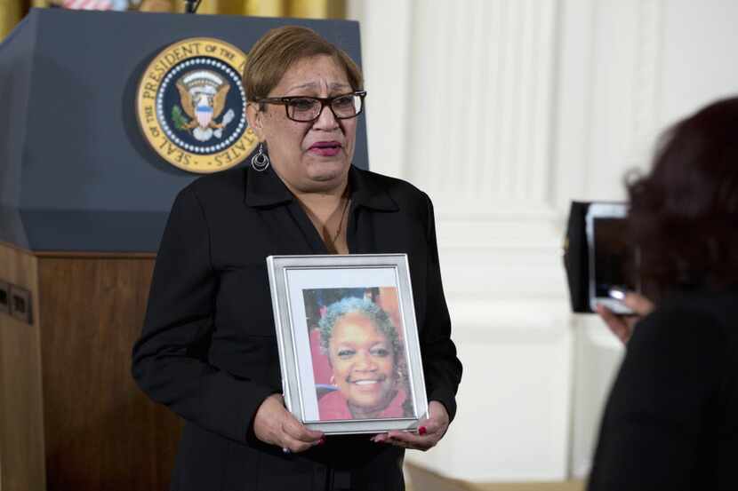  Rev. Sharon Risher holds an image of Ethel Lance, who was shot and killed at Charleston's...
