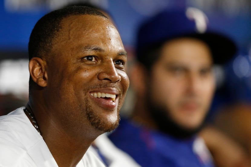 FILE - Texas Rangers third baseman Adrian Beltre (29) smiles as he looks at the big screen...