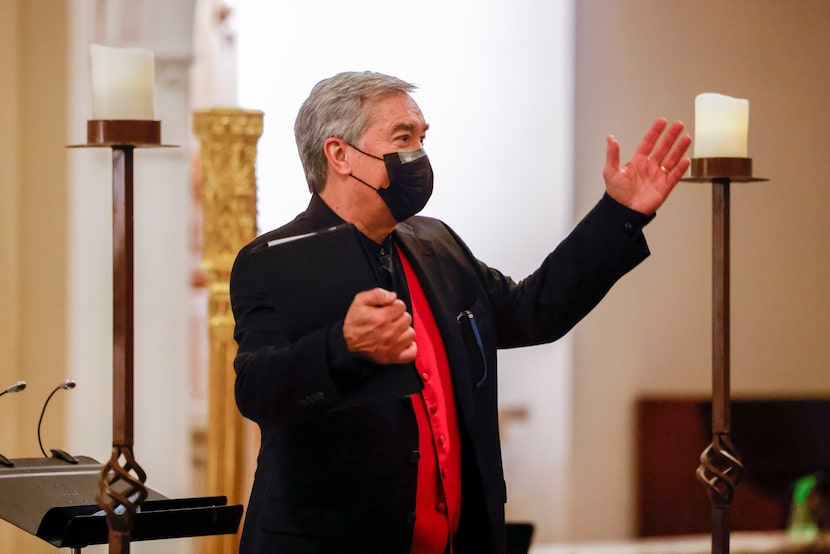 Director Donald Krehbiel waves to the crowd before a performance by the Orpheus Chamber...