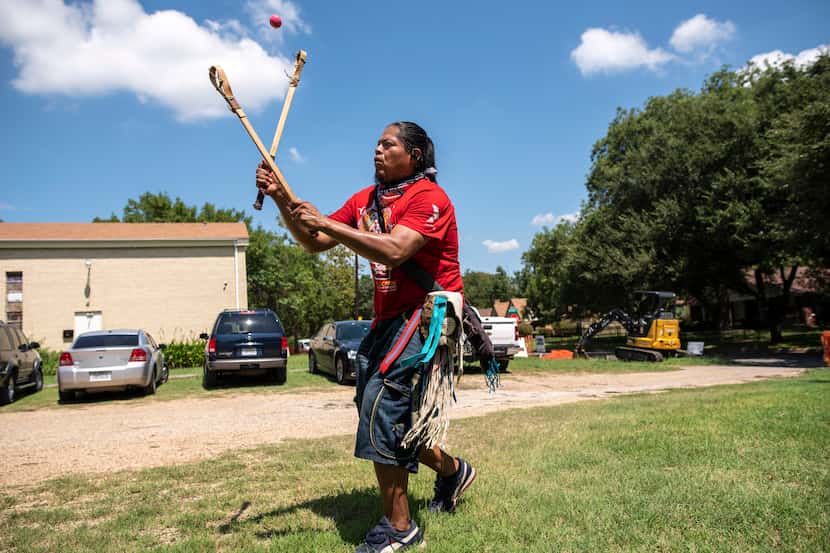 Eli Hickman, 40, of Choctaw/Navajo people, plays a Native American stick ball game...