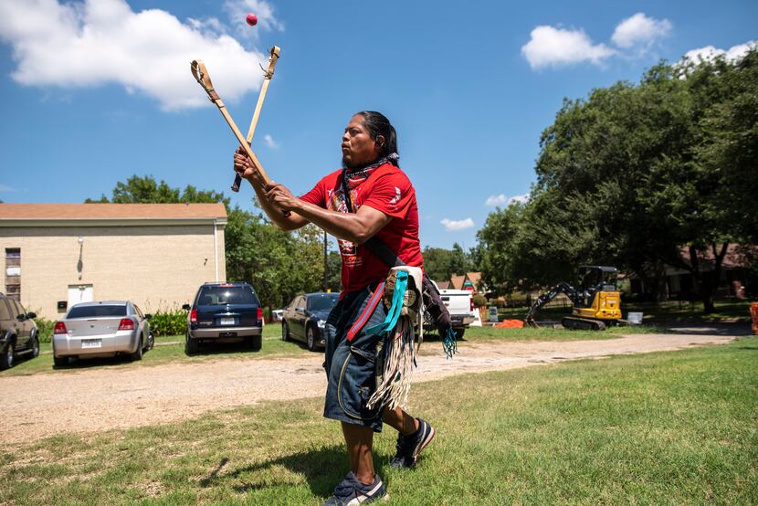 Eli Hickman, 40, of the Choctaw/Navajo people, played a Native American stick ball game...