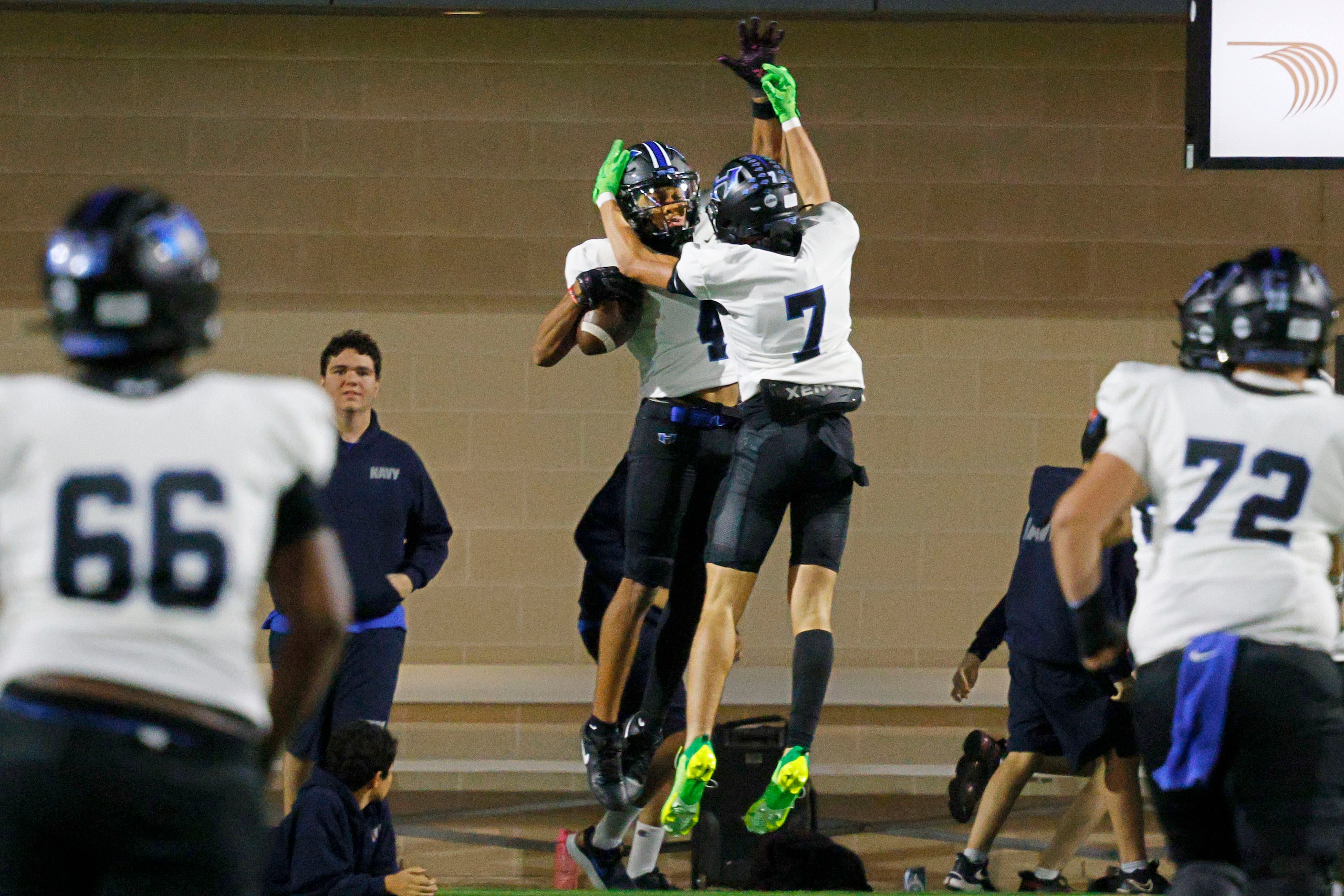 Hebron's Sheldon Armour (4), face to camera, celebrates with his teammate Hebron's Tyler...