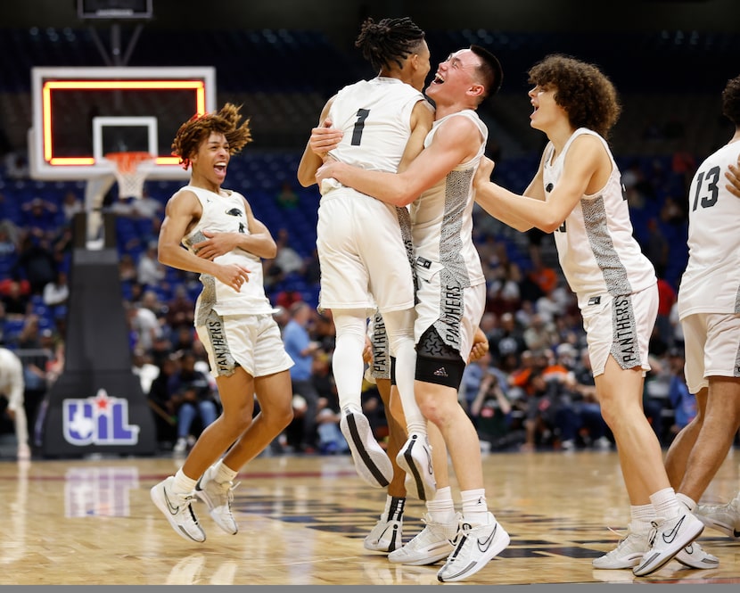 Plano East's Jordan Mizell (4) celebrates at the end of the game as Rachard Angton (1) jumps...