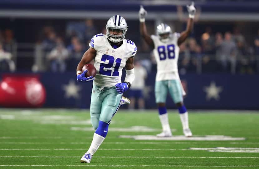 ARLINGTON, TX - DECEMBER 26: Ezekiel Elliott #21 of the Dallas Cowboys runs for a touchdown...