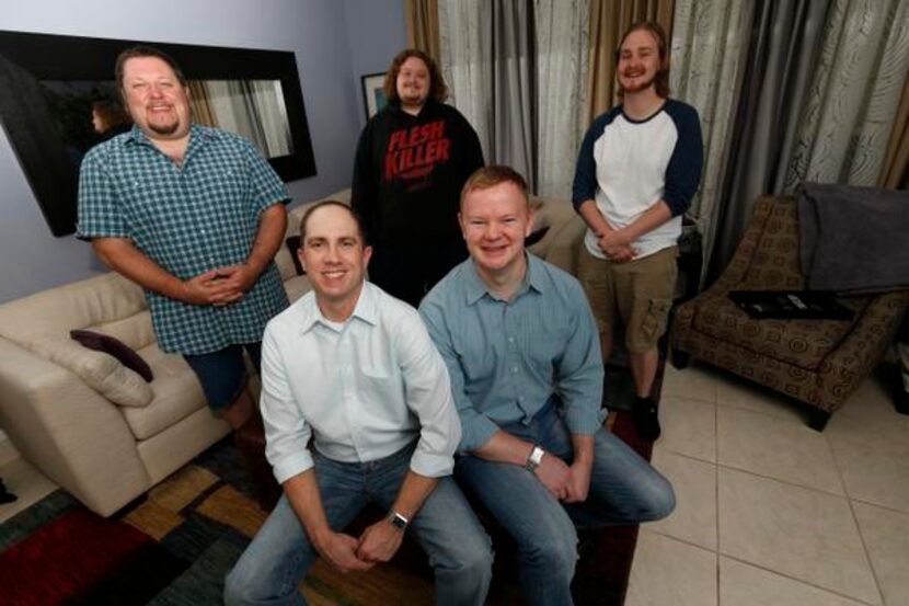 
Brian Lane (front left) and Jonathan Boyd (front right) run Wellspring House, a residential...