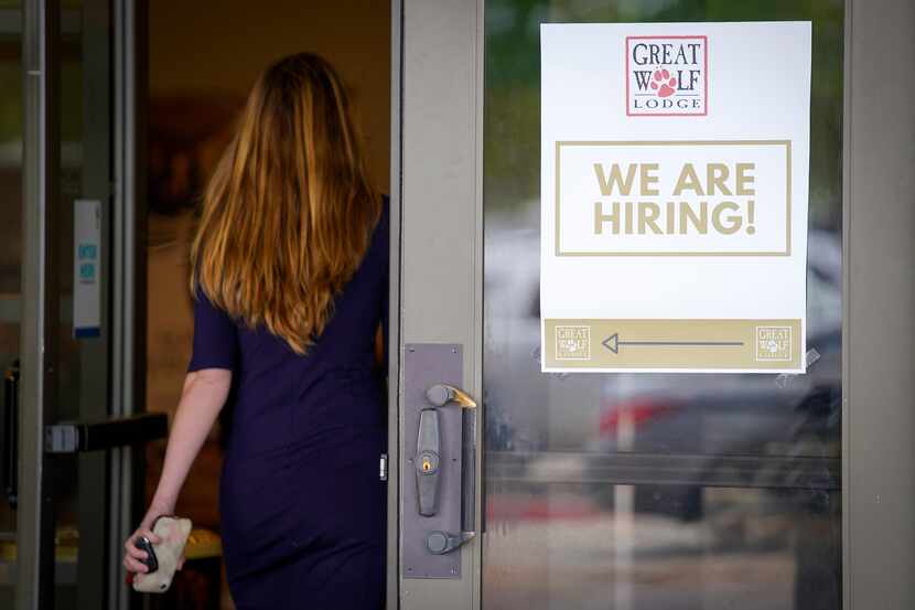 A sign directs job candidates to a hiring event at Great Wolf Lodge Grapevine on May 4. The...