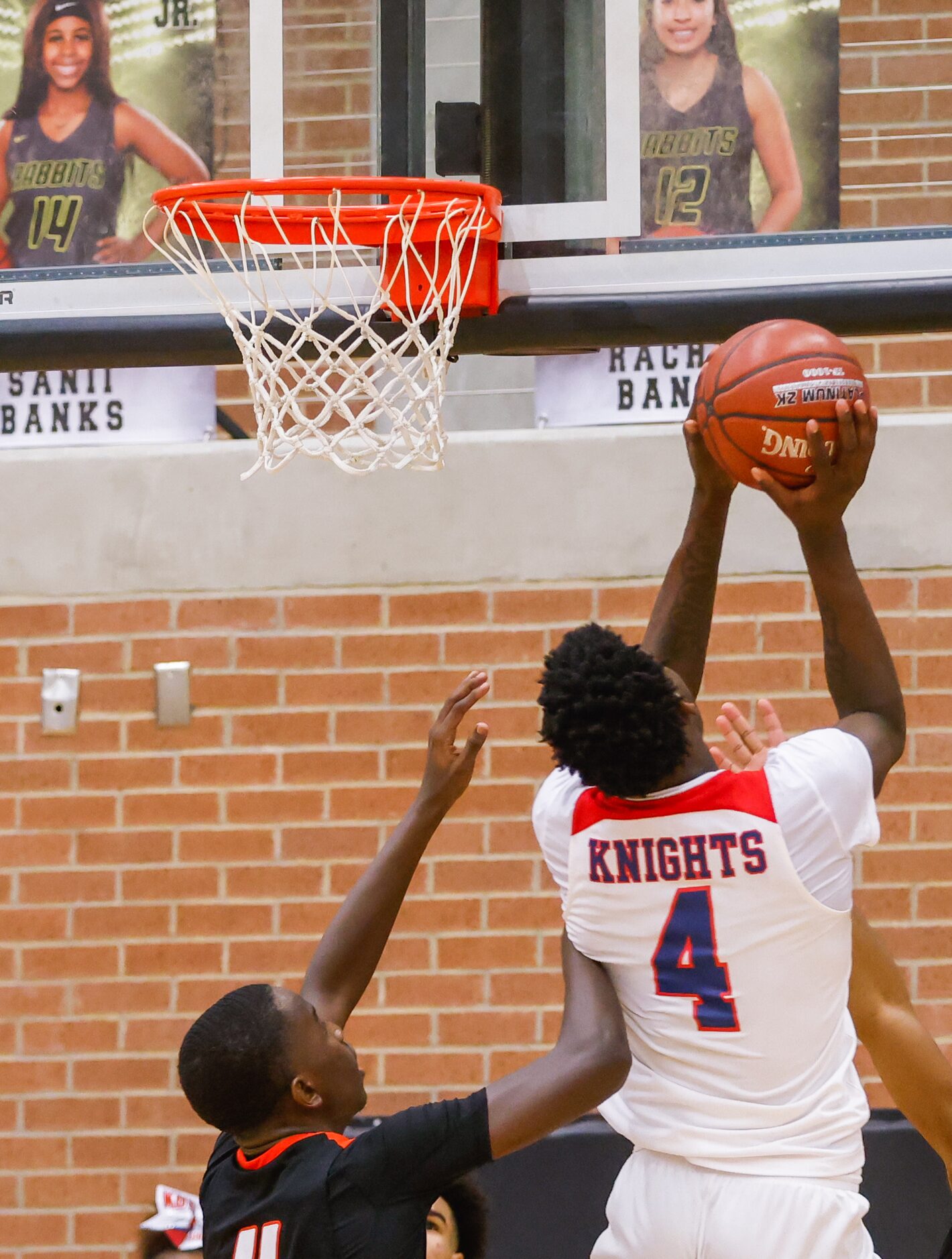 Kimball's Kyron Henderson (4) scores a shot over Lancaster during the overtime of a boys...