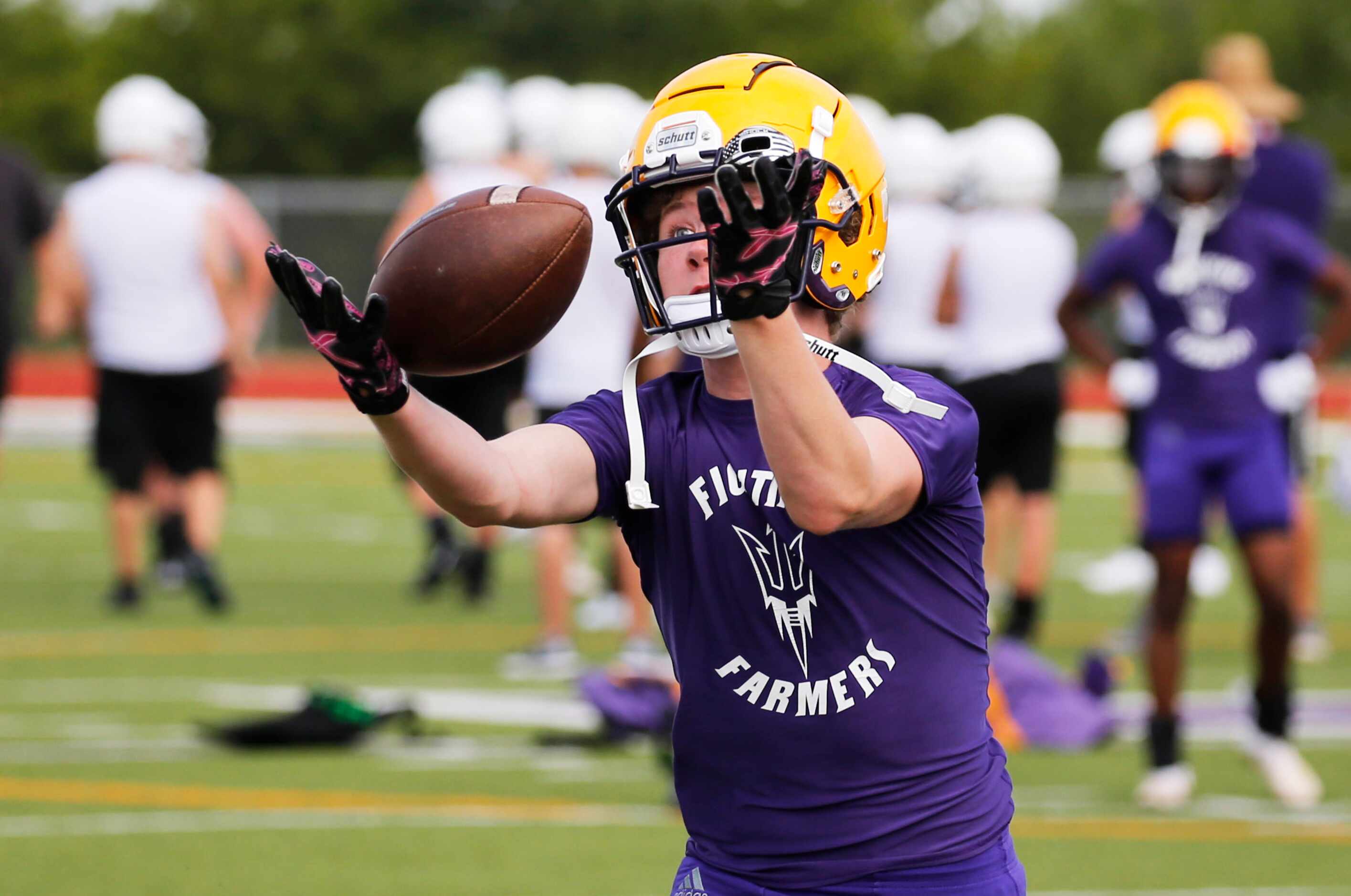 Farmersville's Gavin Parks makes a catch in a drill during the first day of high school...
