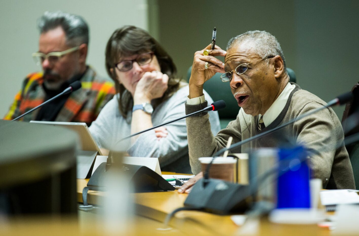 Commissioner Donald Payton (right) speaks as the Dallas Landmark Commission debates before...