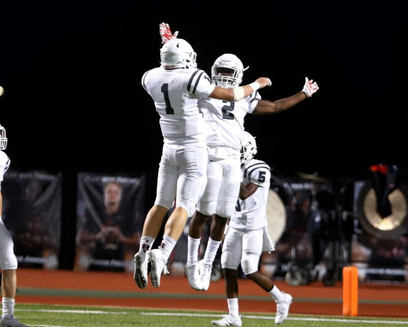 Rockwall Heath's Grant Buckholt (1) and Tanner McCalister (2) celebrate McCalister's after...