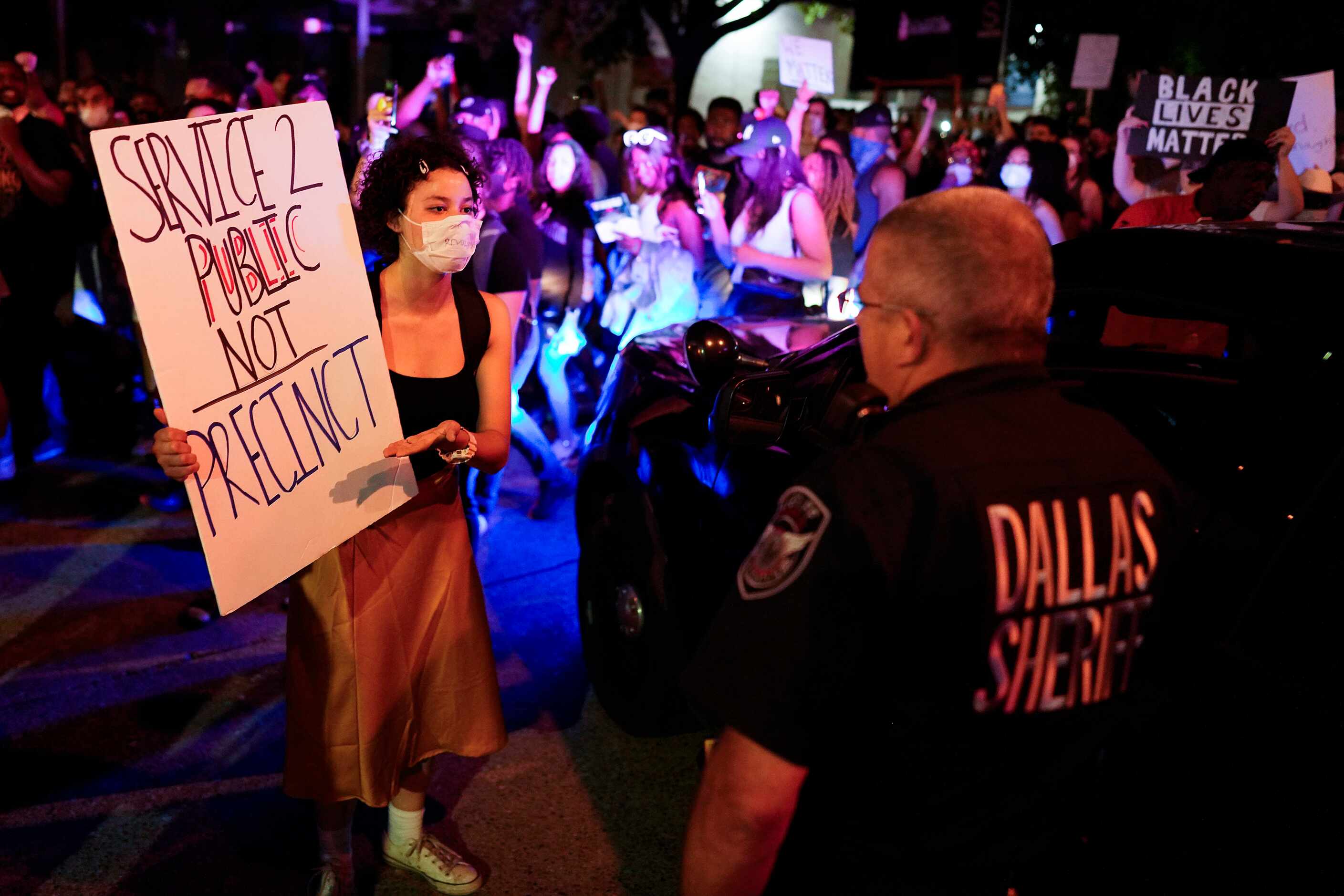 A woman confronts a Dallas County SheriffÕs deputy during a protest against police brutality...