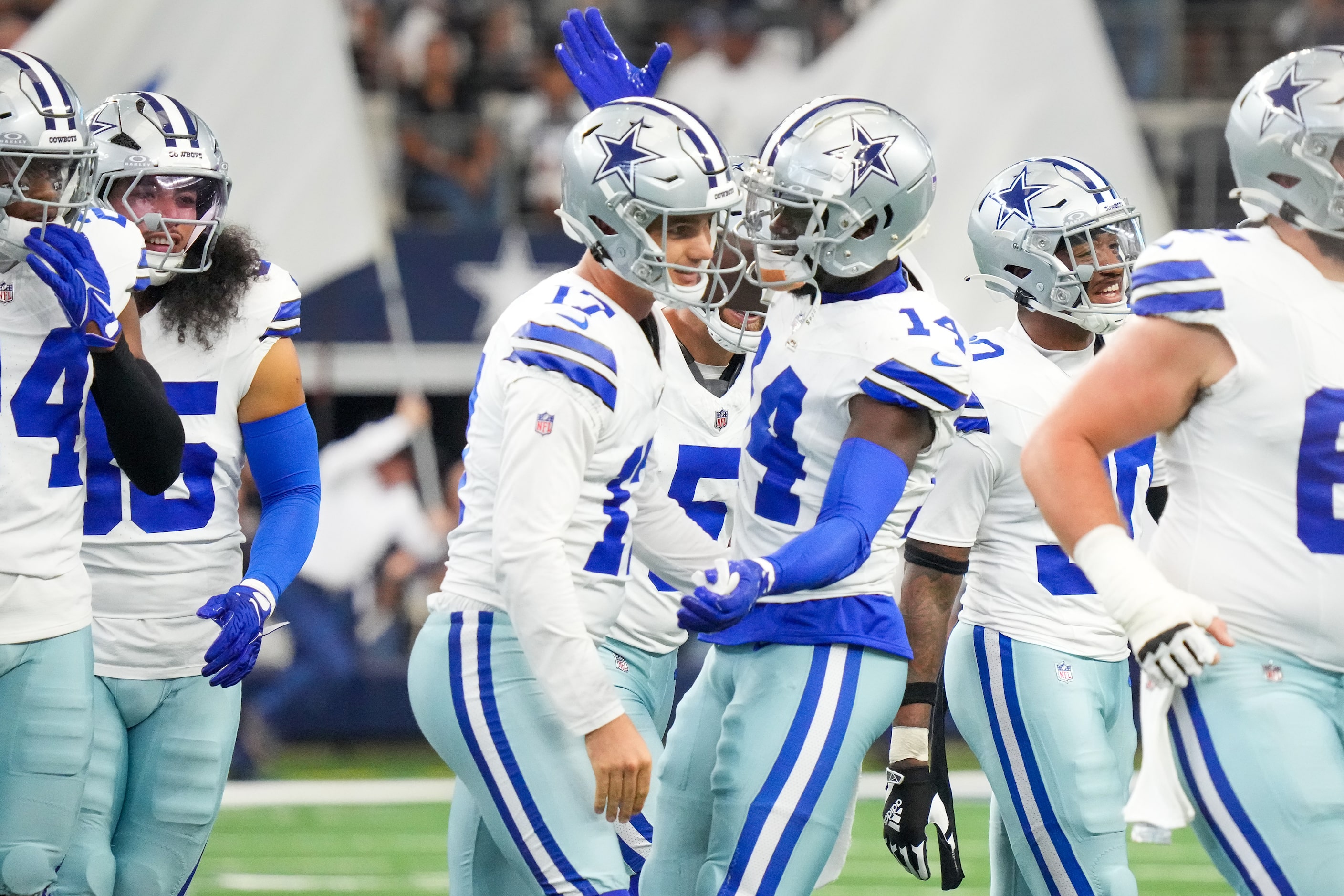 Dallas Cowboys place kicker Brandon Aubrey (17) celebrates with safety Markquese Bell (14)...