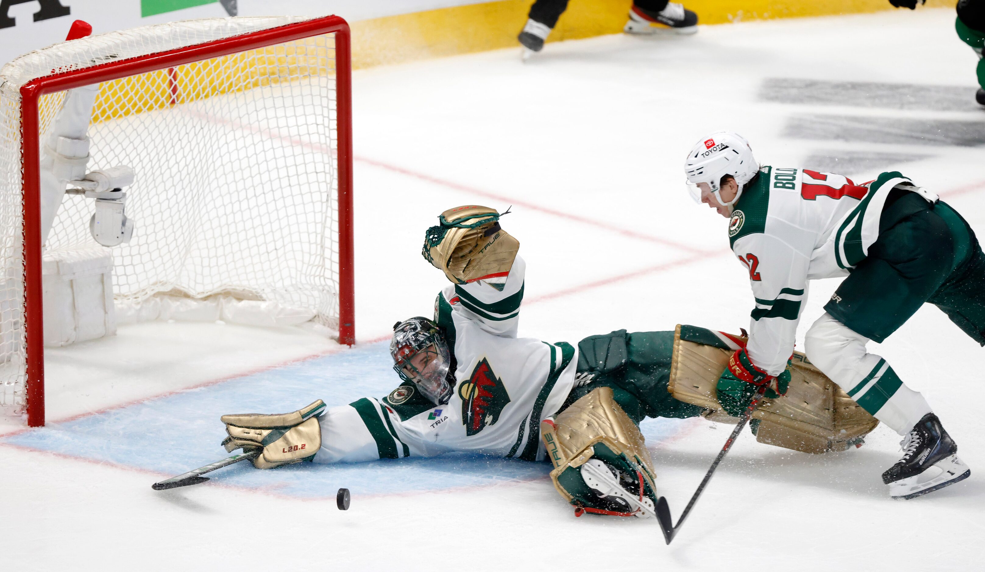 Minnesota Wild goaltender Marc-Andre Fleury (29) reaches in vein for the puck before Dallas...