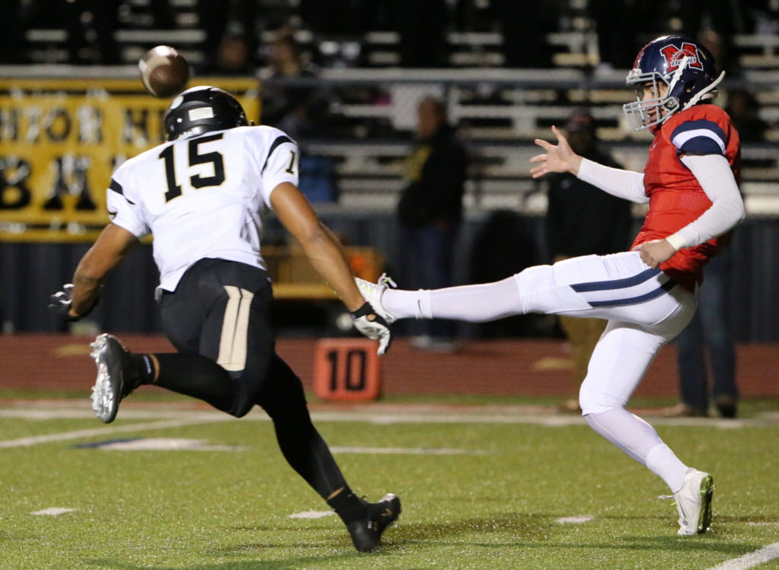 McKinney Boyd punter Derek Dickman (7) punts the ball after mishandling the ball while Plano...