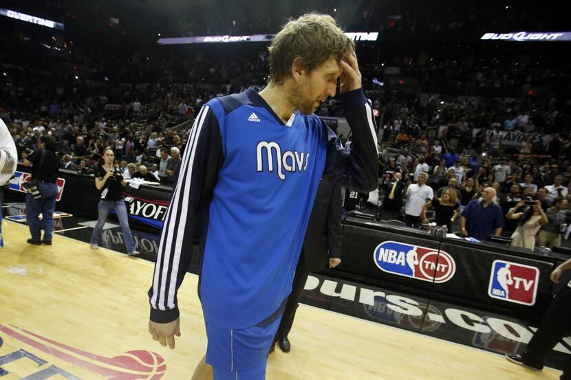 Dallas Mavericks forward Dirk Nowitzki (41) exits the court  after losing game 7 in the...