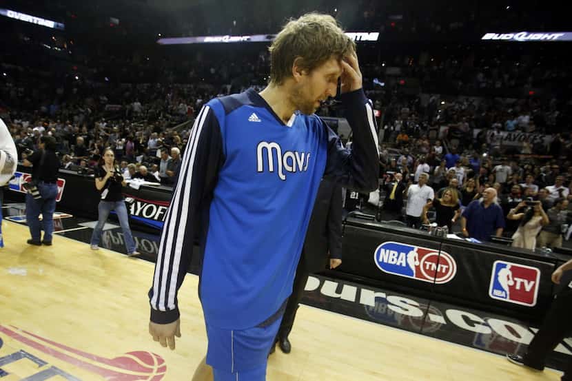 Dallas Mavericks forward Dirk Nowitzki (41) exits the court  after losing game 7 in the...
