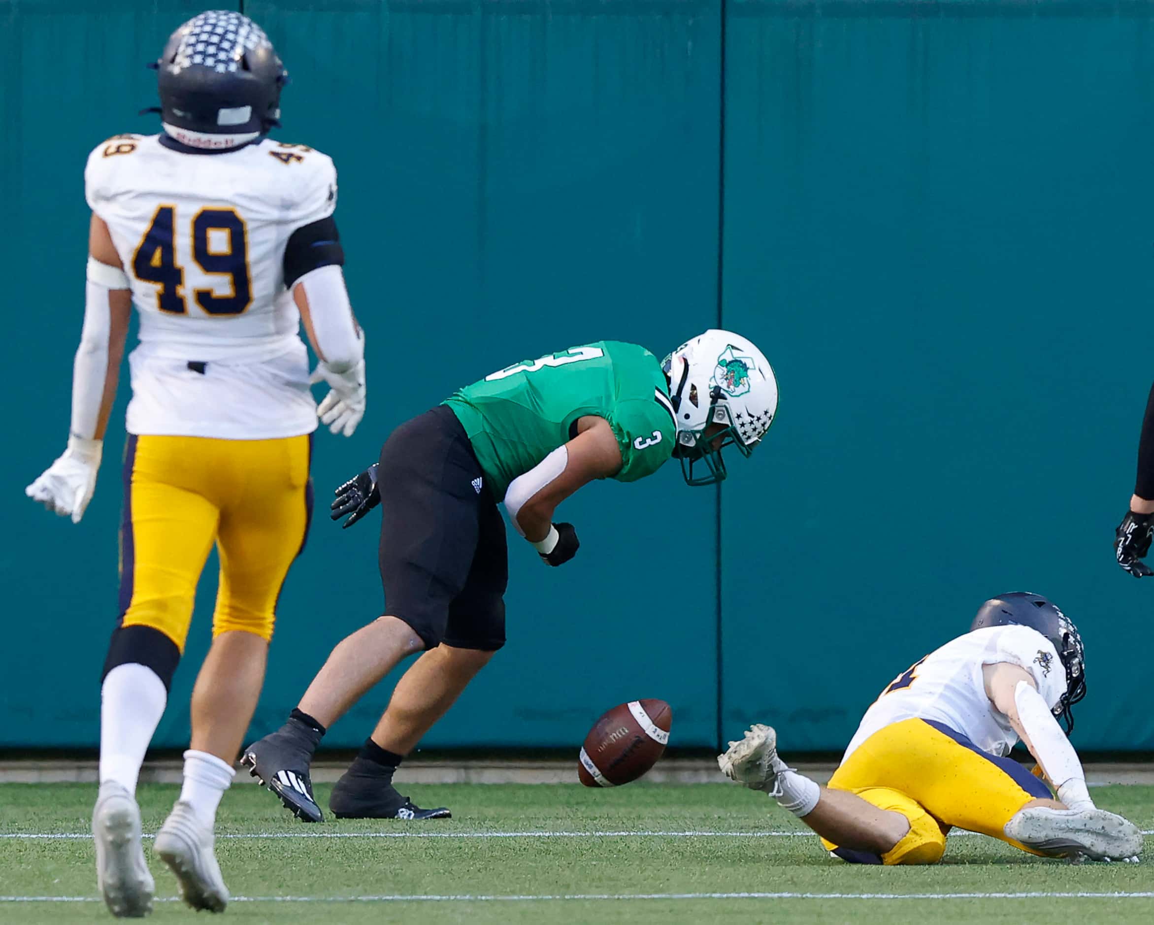 Southlake Carroll running back Davis Penn (3) spins the ball in the end zone after scoring...
