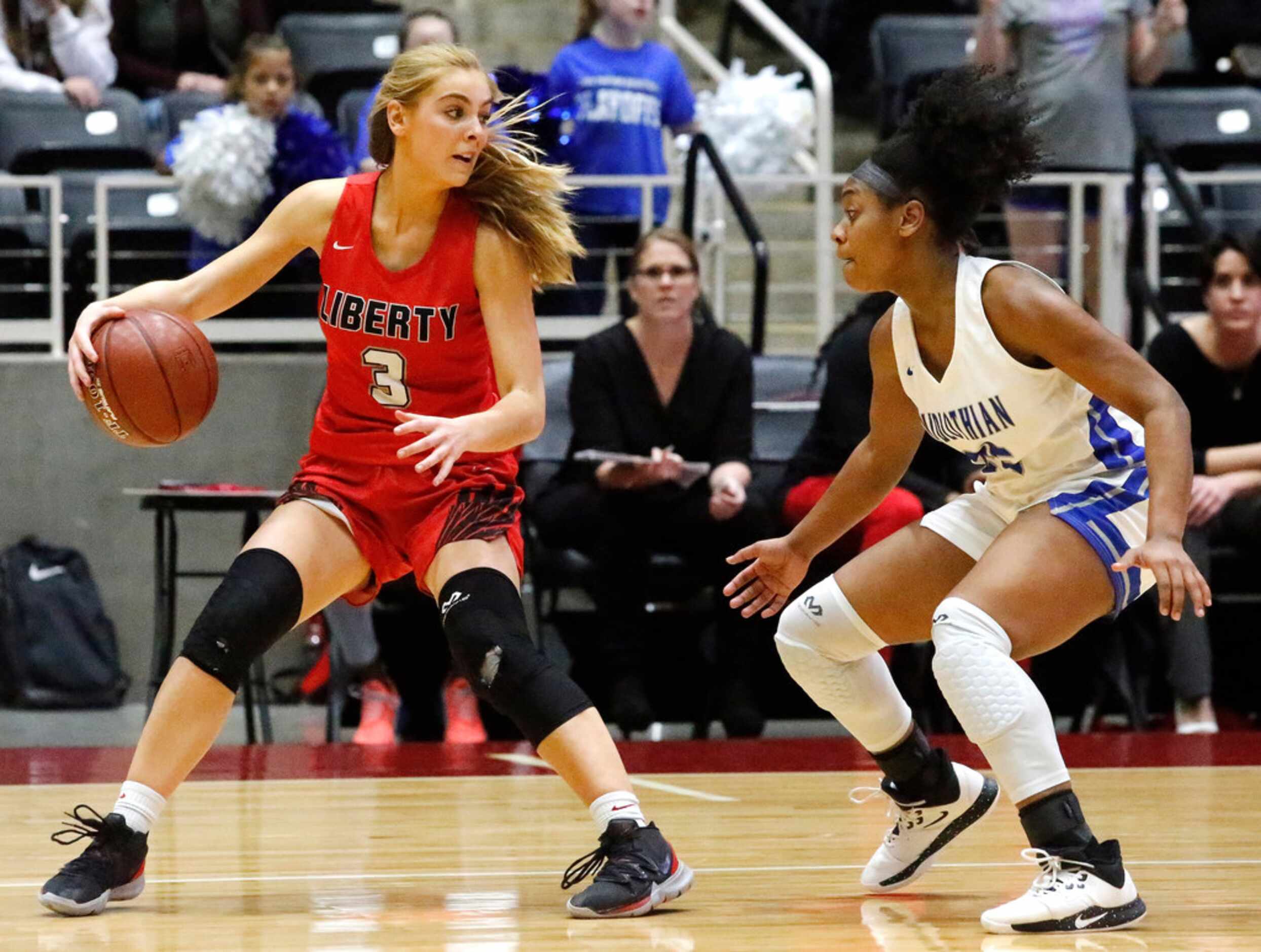 Frisco Liberty High School guard Lily Ziemkiewicz (3) looks for a pass outlet as Midlothian...