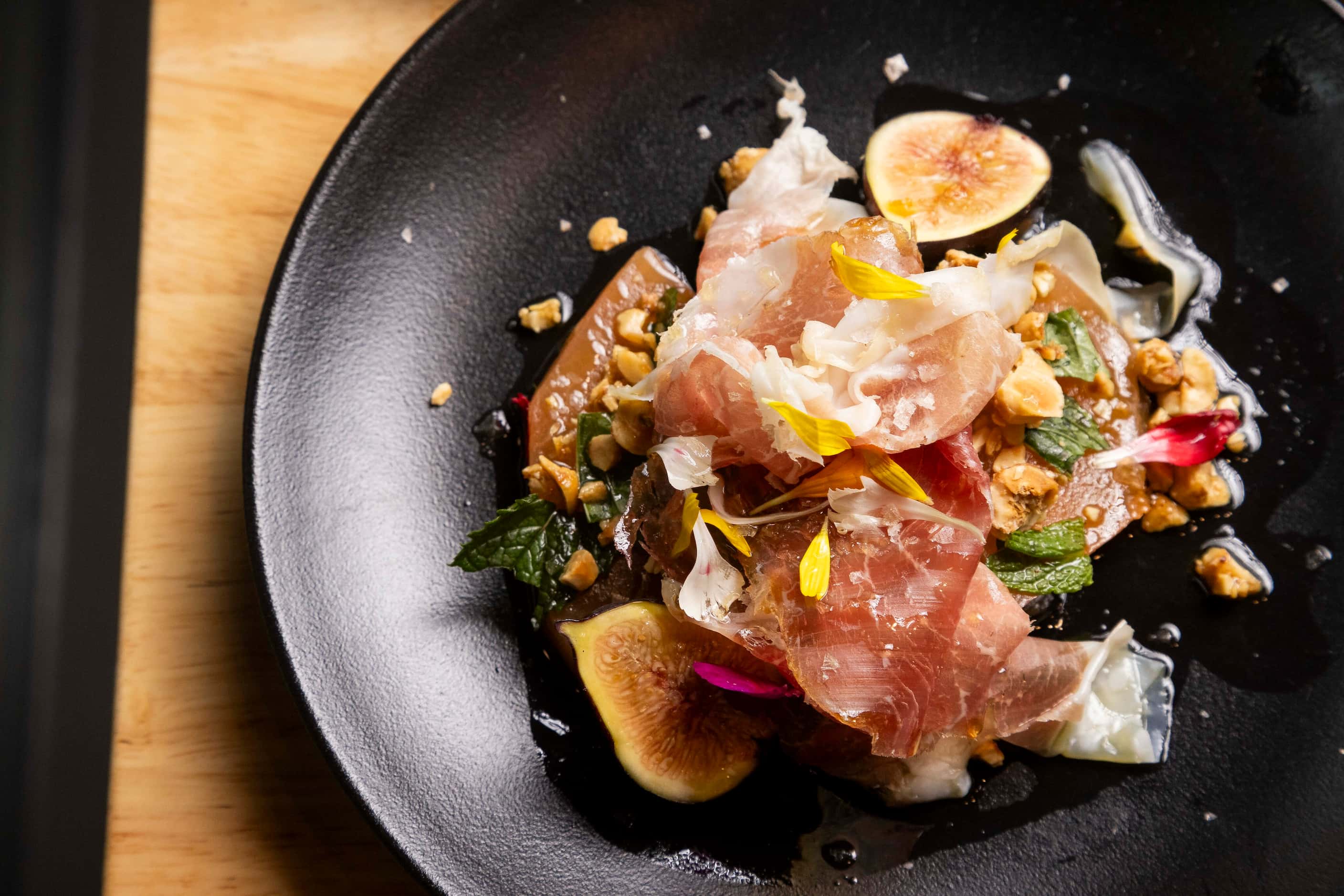 The Prosciutto e Melone dish was created because Derry wanted to find a way to incorporate a...
